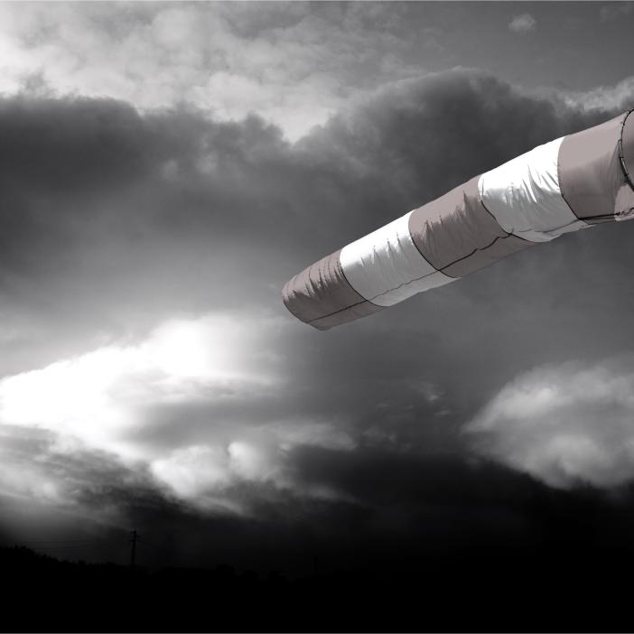 A windsock aids navigation amidst a brewing storm